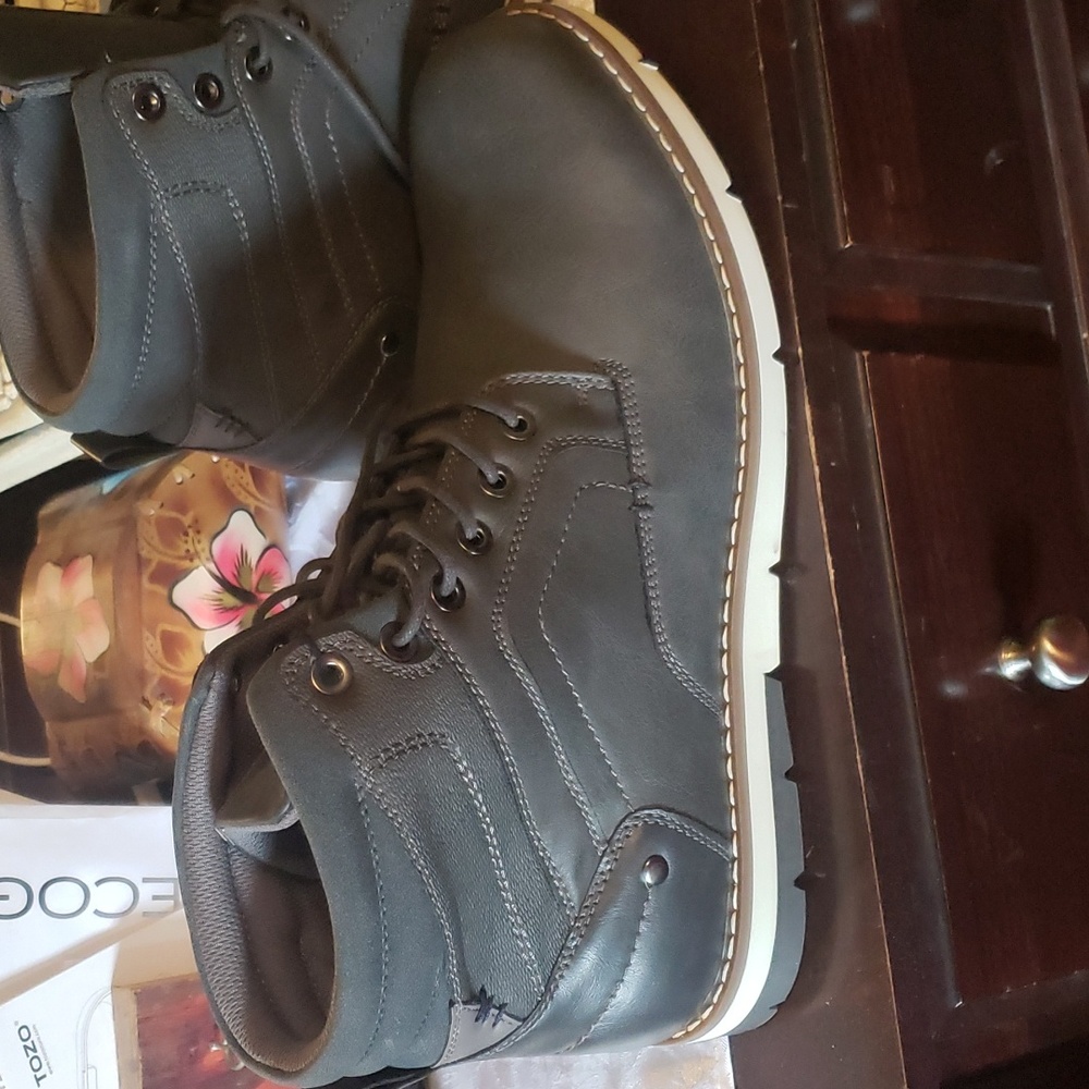 Size 13 mens boots never worn , from kohl's.  Gray in color